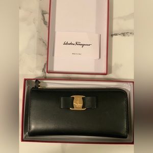 Black Salvatore Ferragamo leather wallet with gold hardware